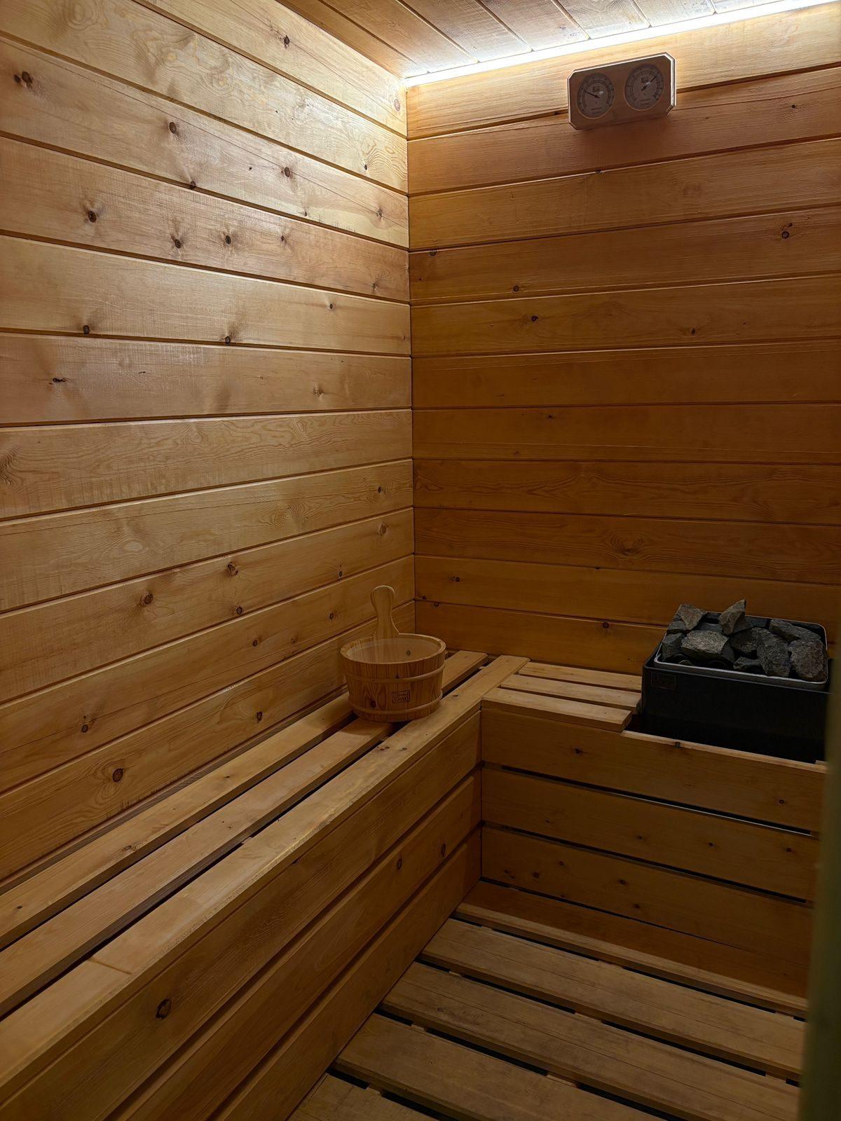 The Glow-Fit Finnish sauna with cedar benches and heater
